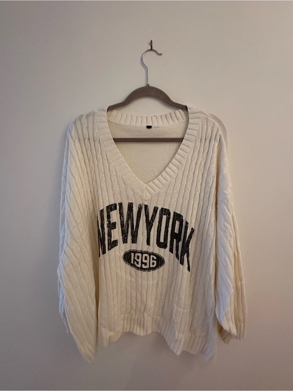 Cream V-Neck Cable Knit Sweater with 'New York 1996' Print